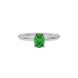 Close-up emerald green gemstone ring, white gold surprise diamond setting.