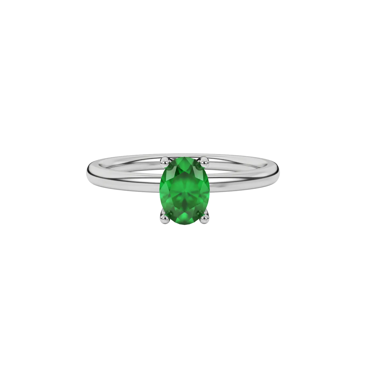 Close-up emerald green gemstone ring, white gold surprise diamond setting.