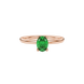 Close-up, oval cut emerald green gemstone ring, rose gold surprise diamond setting.