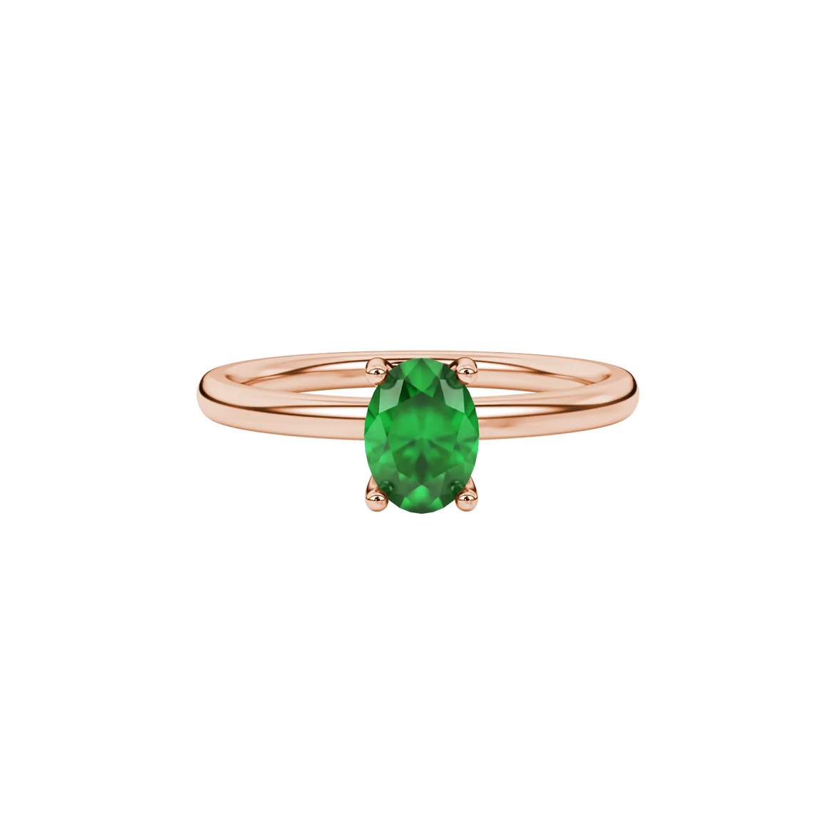 Close-up, oval cut emerald green gemstone ring, rose gold surprise diamond setting.