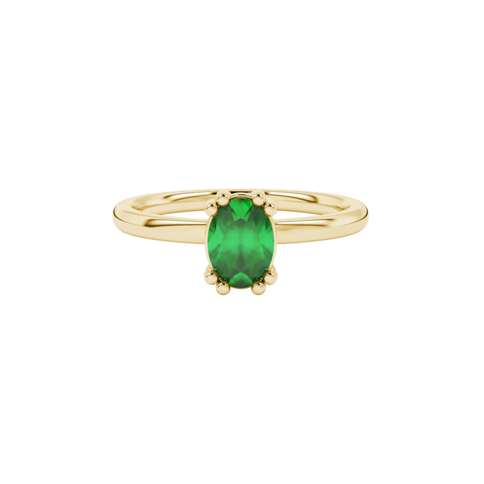 Close-up, oval cut emerald green gemstone, yellow gold vintage basket ring.