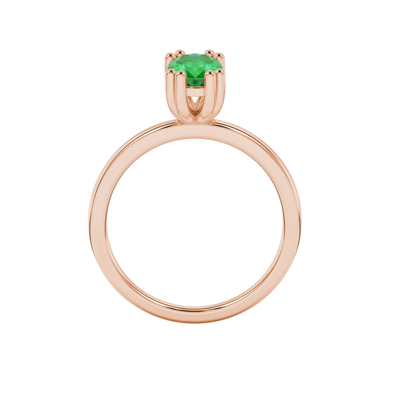 Oval cut emerald green gemstone ring, rose gold vintage basket setting.