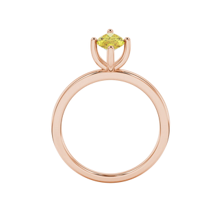 Marquise cut canary yellow gemstone ring, rose gold four prong setting.
