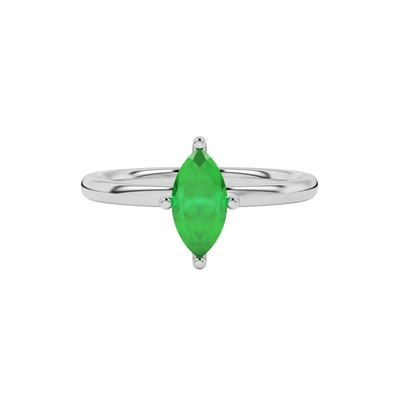 Close-up marquise cut emerald green gemstone ring, white gold four prong.