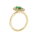 Side profile, yellow gold emerald green ring, falling edge halo gallery.