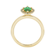 Marquise cut emerald green gemstone ring, yellow gold French pavé halo setting.