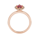Marquise cut raspberry red gemstone ring, rose gold French pavé halo setting.