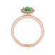 Marquise cut emerald green gemstone ring, rose gold French pavé halo setting.