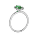 Side profile, white gold emerald green ring, French pavé halo gallery.