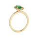 Side profile, yellow gold emerald green ring, French pavé halo gallery.