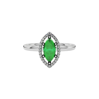 Close-up marquise cut emerald green gemstone ring, white gold French pavé halo.