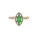 Close-up, marquise cut emerald green gemstone ring, rose gold French pavé halo.