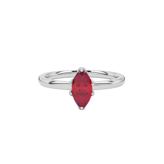 Close-up marquise cut raspberry red gemstone ring, white gold scalloped six prong.