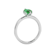 Side profile, white gold emerald green ring, scalloped six prong gallery.