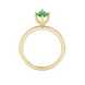 Marquise cut emerald green gemstone ring, yellow gold surprise diamond setting.