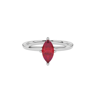 Close-up marquise cut raspberry red gemstone ring, white gold surprise diamond setting.