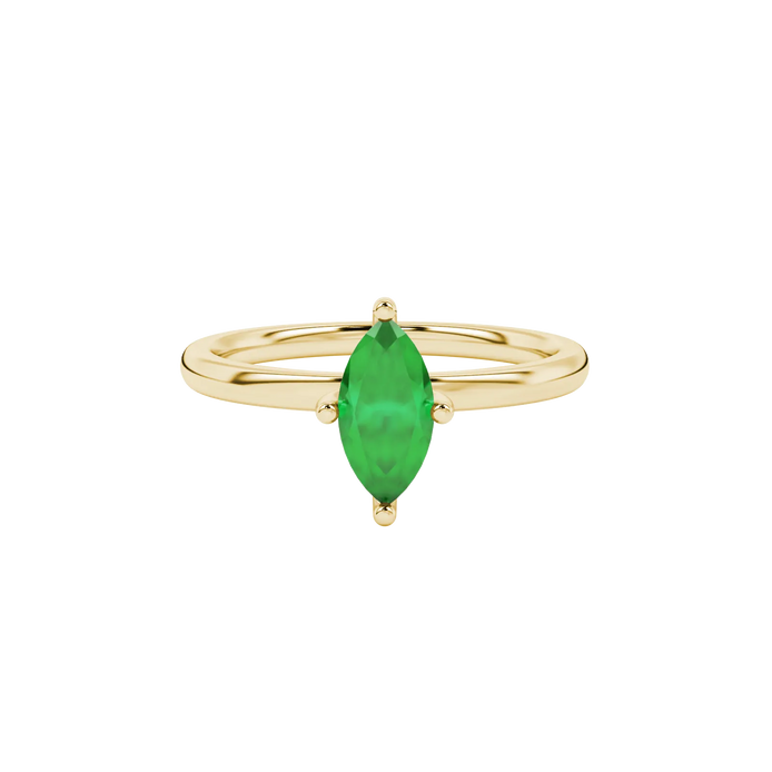 Close-up, marquise cut emerald green gemstone, yellow gold surprise diamond ring.