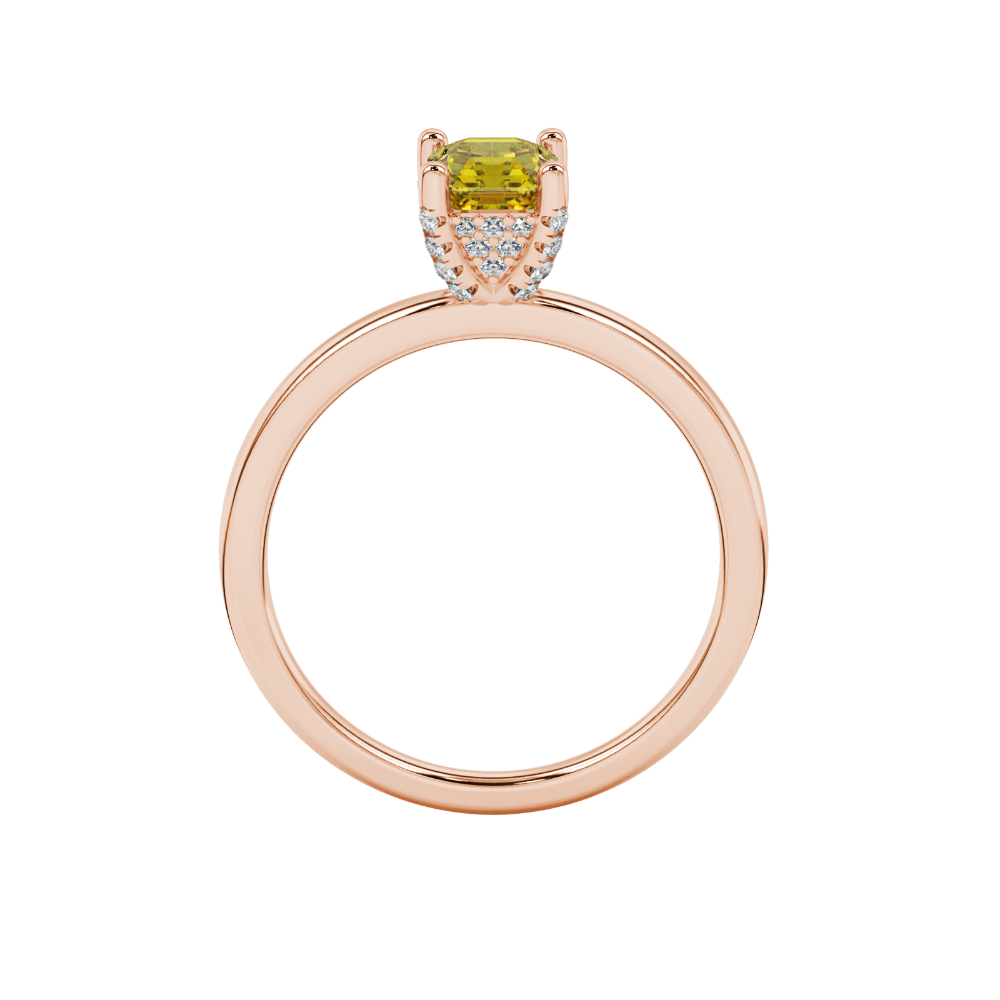 Emerald cut hidden halo solitaire ring in gold featuring a 5.00 MM center gemstone secured in a four-prong setting