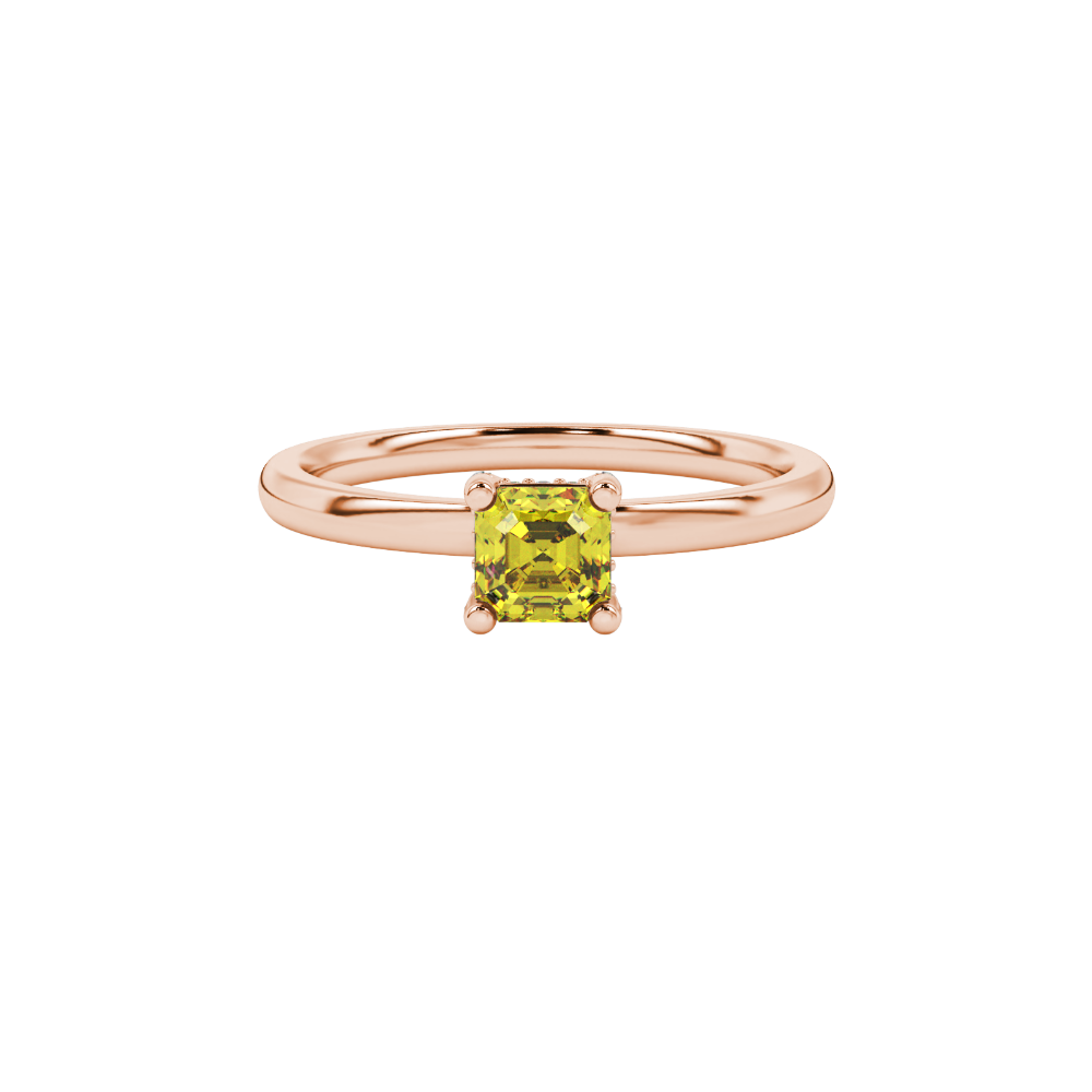 Emerald cut hidden halo solitaire ring in gold featuring a 5.00 MM center gemstone secured in a four-prong setting