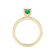 Green cushion cut gemstone solitaire ring in gold featuring a refined four-prong cathedral basket setting