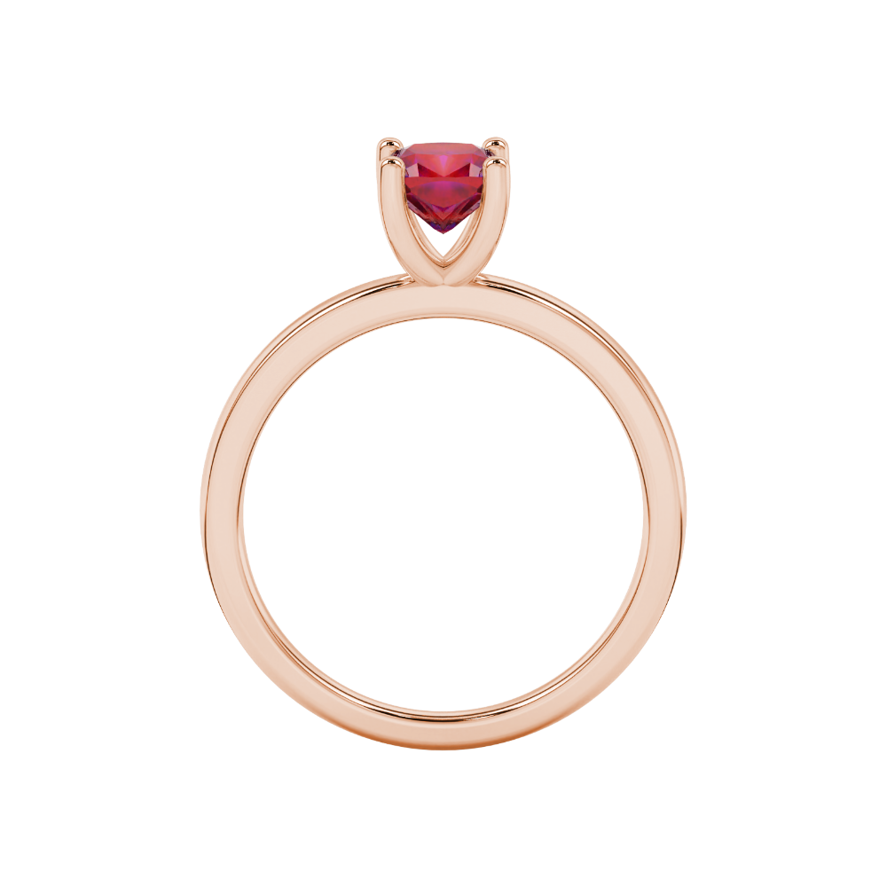 Red cushion cut gemstone solitaire ring in gold featuring a refined four-prong cathedral basket setting