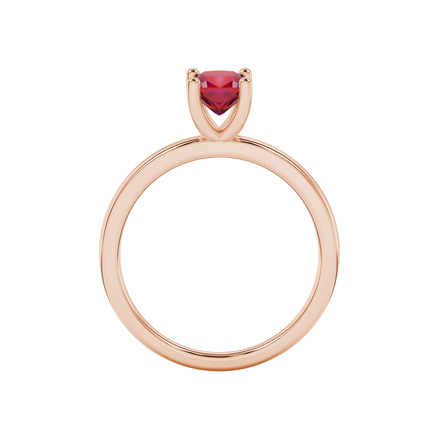Red cushion cut gemstone solitaire ring in gold featuring a refined four-prong cathedral basket setting
