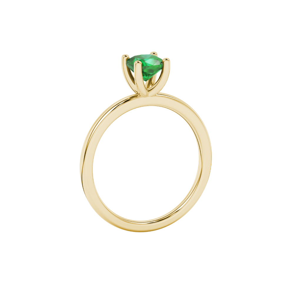 Green cushion cut gemstone solitaire ring in gold featuring a refined four-prong cathedral basket setting