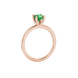 Green cushion cut gemstone solitaire ring in gold featuring a refined four-prong cathedral basket setting