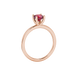 Red cushion cut gemstone solitaire ring in gold featuring a refined four-prong cathedral basket setting