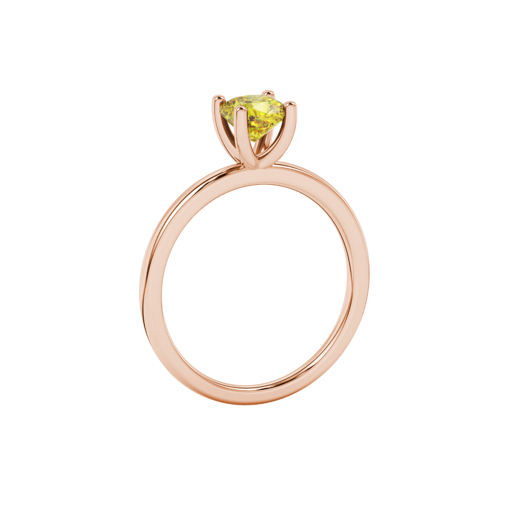 Yellow cushion cut gemstone solitaire ring in gold featuring a refined four-prong cathedral basket setting