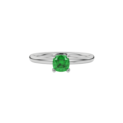 Green cushion cut gemstone solitaire ring in gold featuring a refined four-prong cathedral basket setting