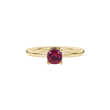 Red cushion cut gemstone solitaire ring in gold featuring a refined four-prong cathedral basket setting