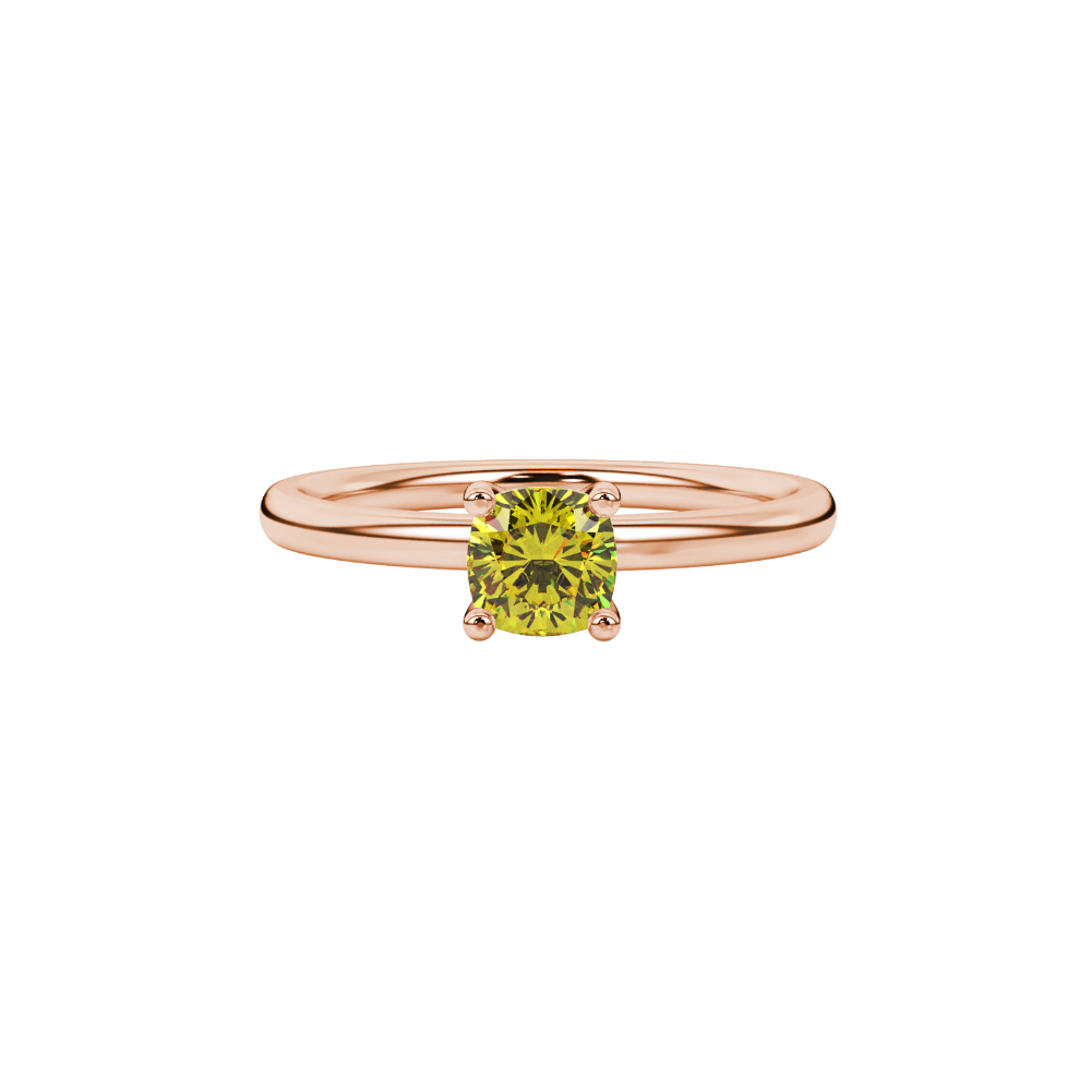 Yellow cushion cut gemstone solitaire ring in gold featuring a refined four-prong cathedral basket setting