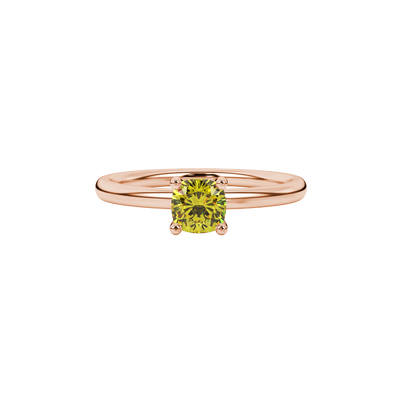 Yellow cushion cut gemstone solitaire ring in gold featuring a refined four-prong cathedral basket setting