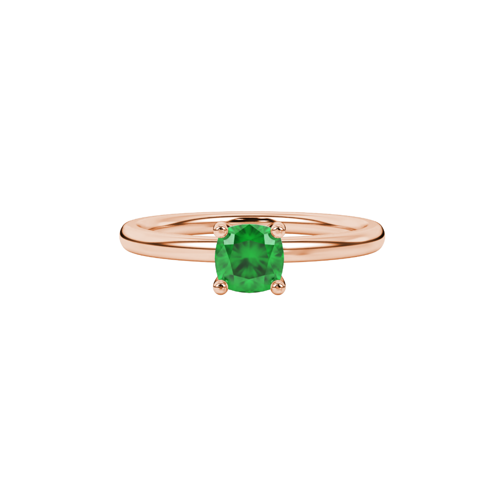 Green cushion cut gemstone solitaire ring in gold featuring a refined four-prong cathedral basket setting
