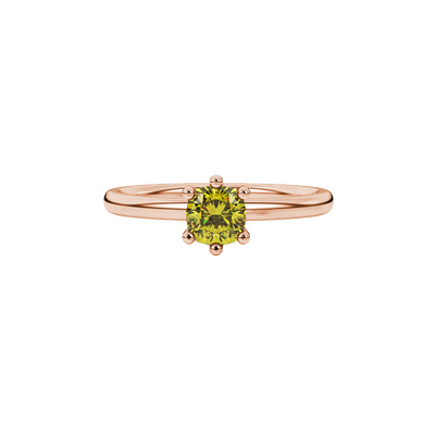 Yellow cushion cut gemstone solitaire ring in gold featuring a six-prong crown basket setting