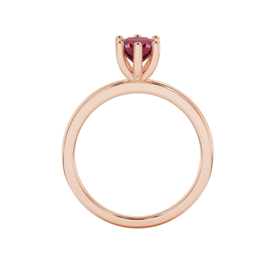 Red cushion cut gemstone solitaire ring in gold featuring a six-prong crown basket setting