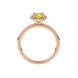 Yellow cushion cut gemstone halo ring with diamond accents in gold