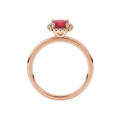 Red cushion cut gemstone halo ring with diamond accents in gold