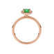Green cushion cut gemstone halo ring with diamond accents in gold