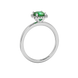 Green cushion cut gemstone halo ring with diamond accents in gold
