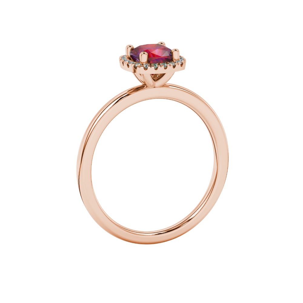Red cushion cut gemstone halo ring with diamond accents in gold