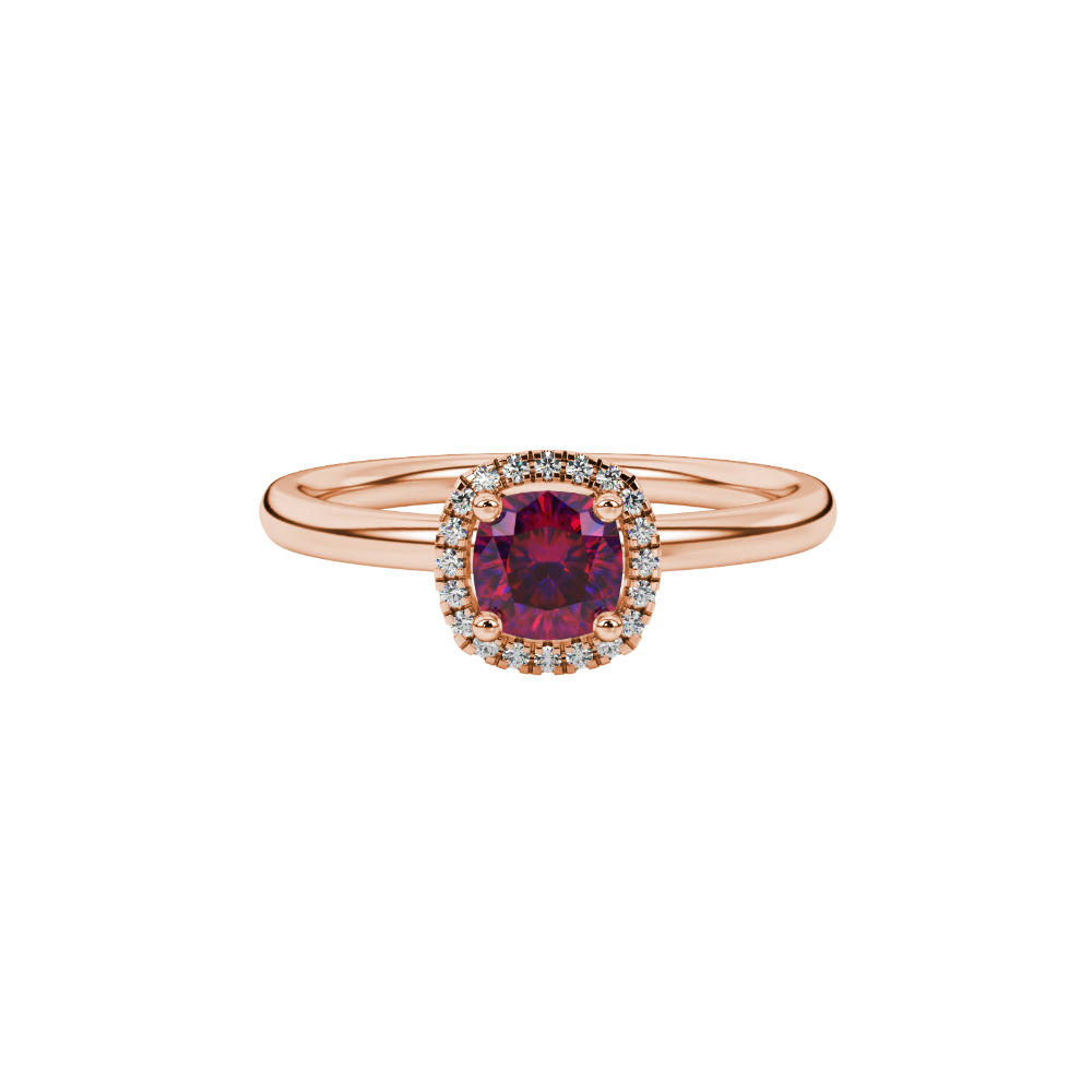 Red cushion cut gemstone halo ring with diamond accents in gold
