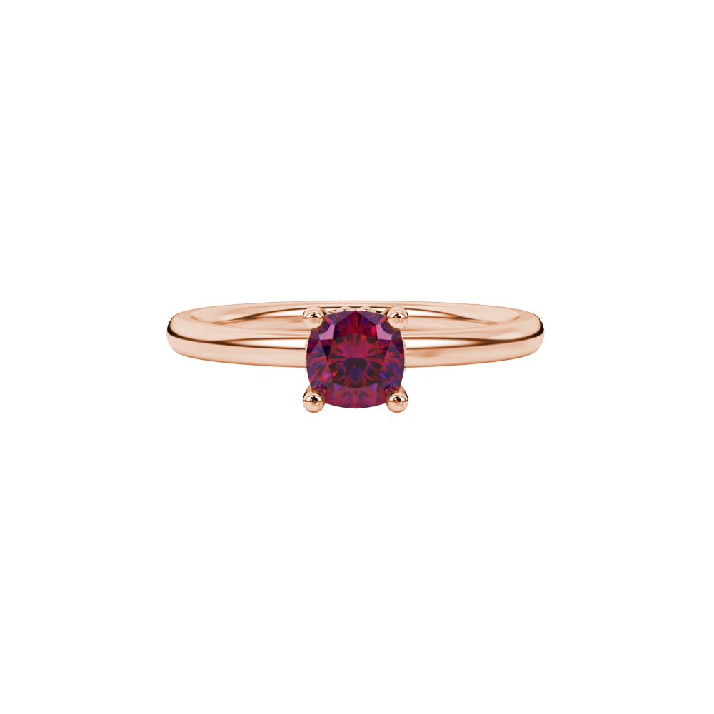 Red cushion cut solitaire gemstone ring in rose gold with classic four prong setting