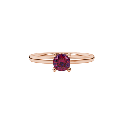 Red cushion cut solitaire gemstone ring in rose gold with classic four prong setting
