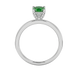 Green cushion cut gemstone ring with diamond gallery detailing in yellow gold