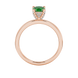 Green cushion cut gemstone ring with diamond gallery detailing in yellow gold
