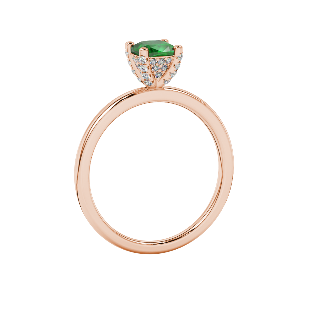 Green cushion cut gemstone ring with diamond gallery detailing in yellow gold