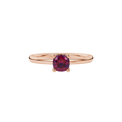 Red cushion cut gemstone ring with diamond gallery detailing in white gold