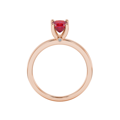 Red cushion cut solitaire gemstone ring with accent diamonds in rose gold four prong setting